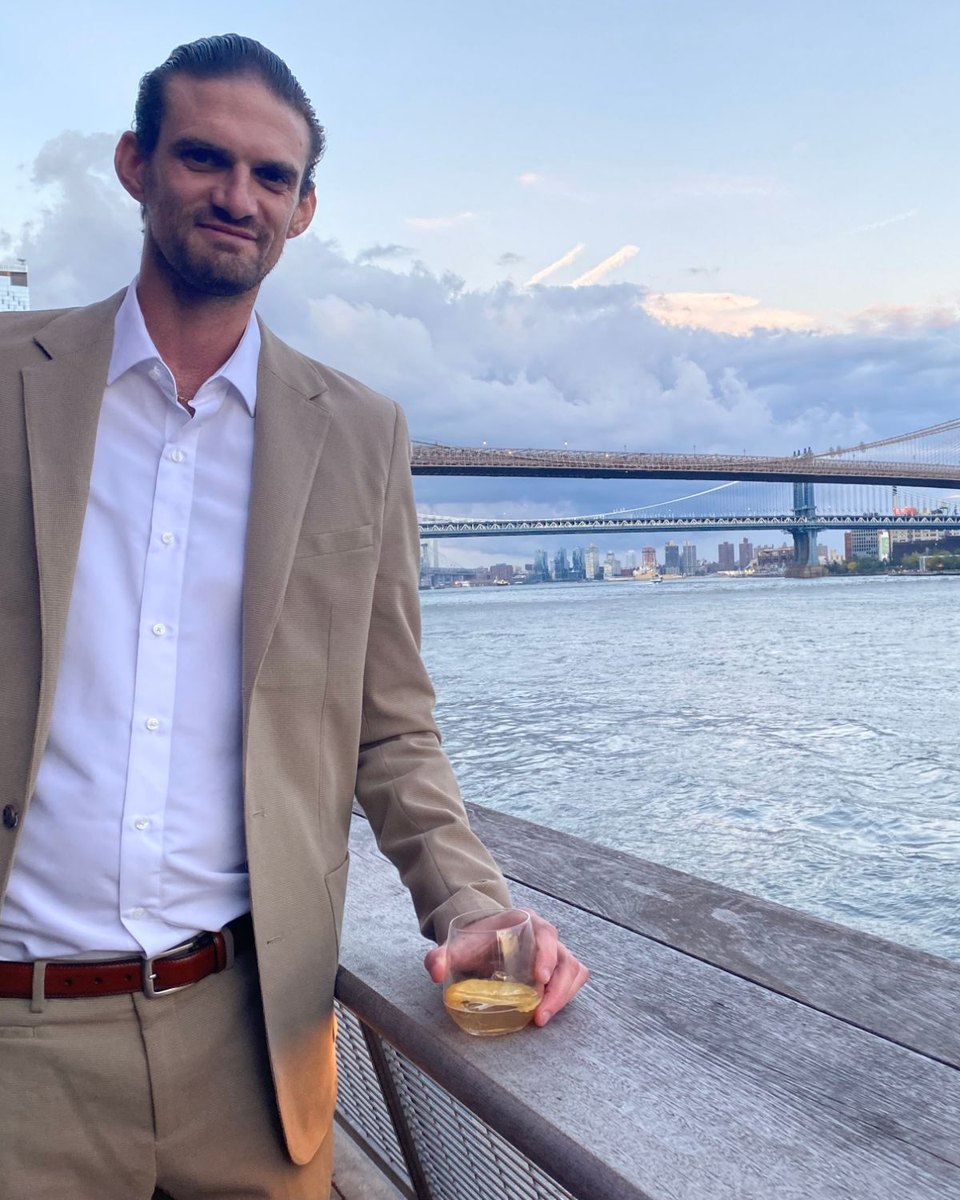 Sam Friedman, founder of Full Value Potential, by the Brooklyn Bridge