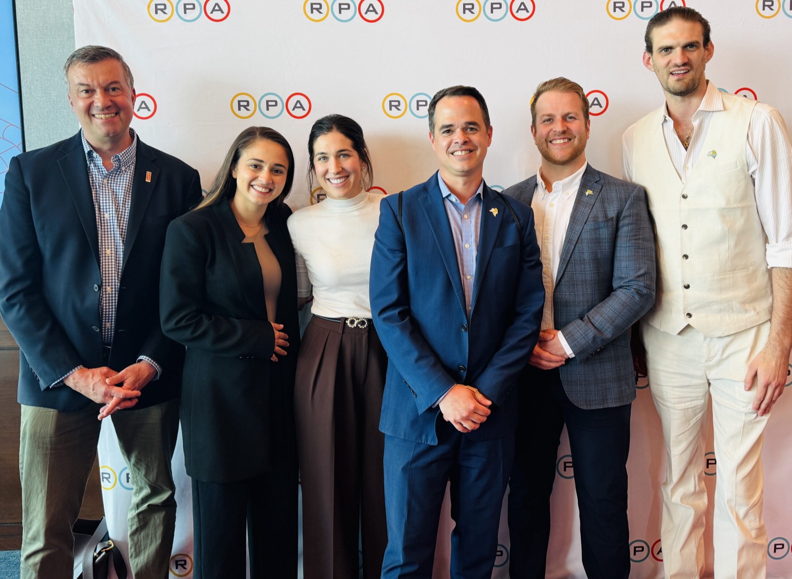 Sam with founders and advisors at an industry event